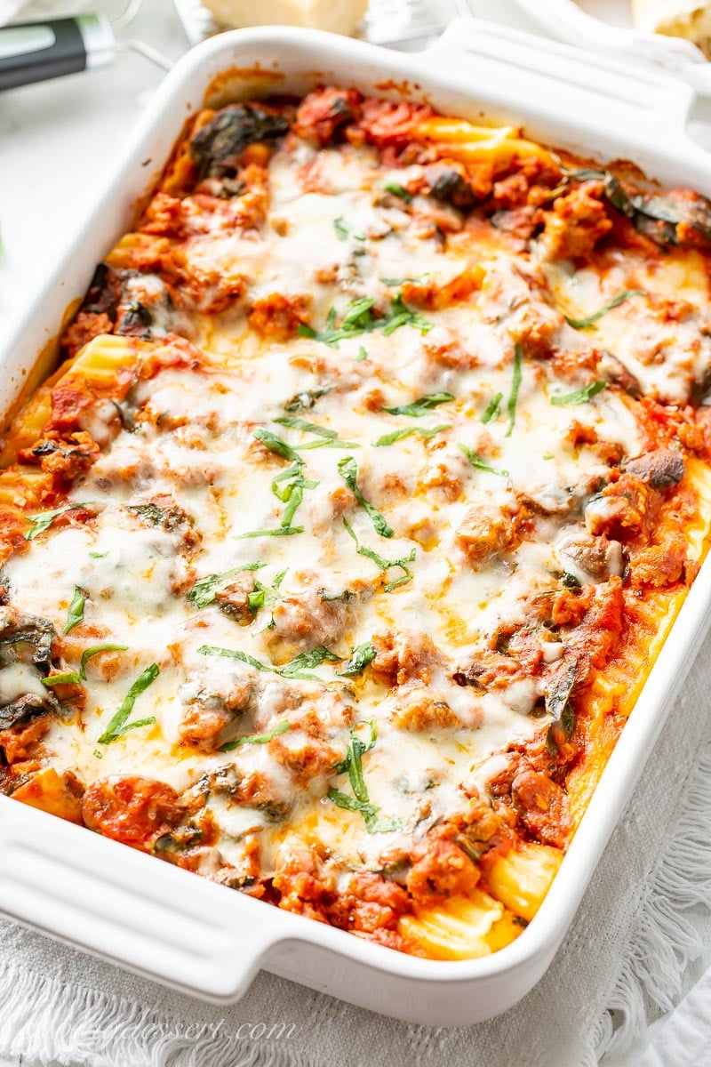 A large casserole dish filled with stuffed manicotti