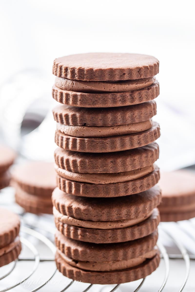 A stack of chocolate creme filled chocolate cookies