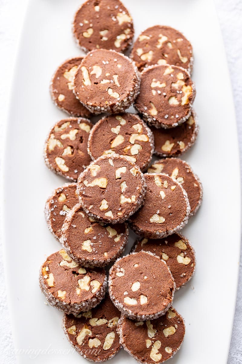 A platter of chocolate shortbread cookies with walnuts