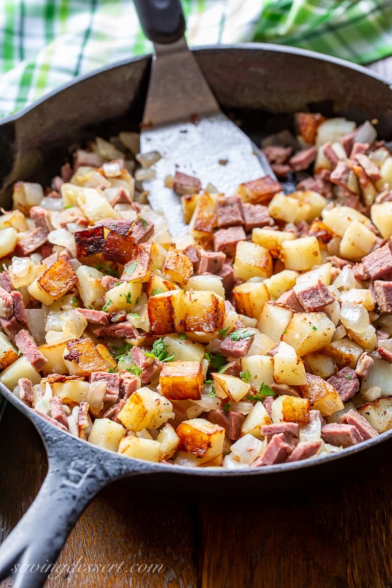 A cast iron skillet filled with homemade corned beef hash