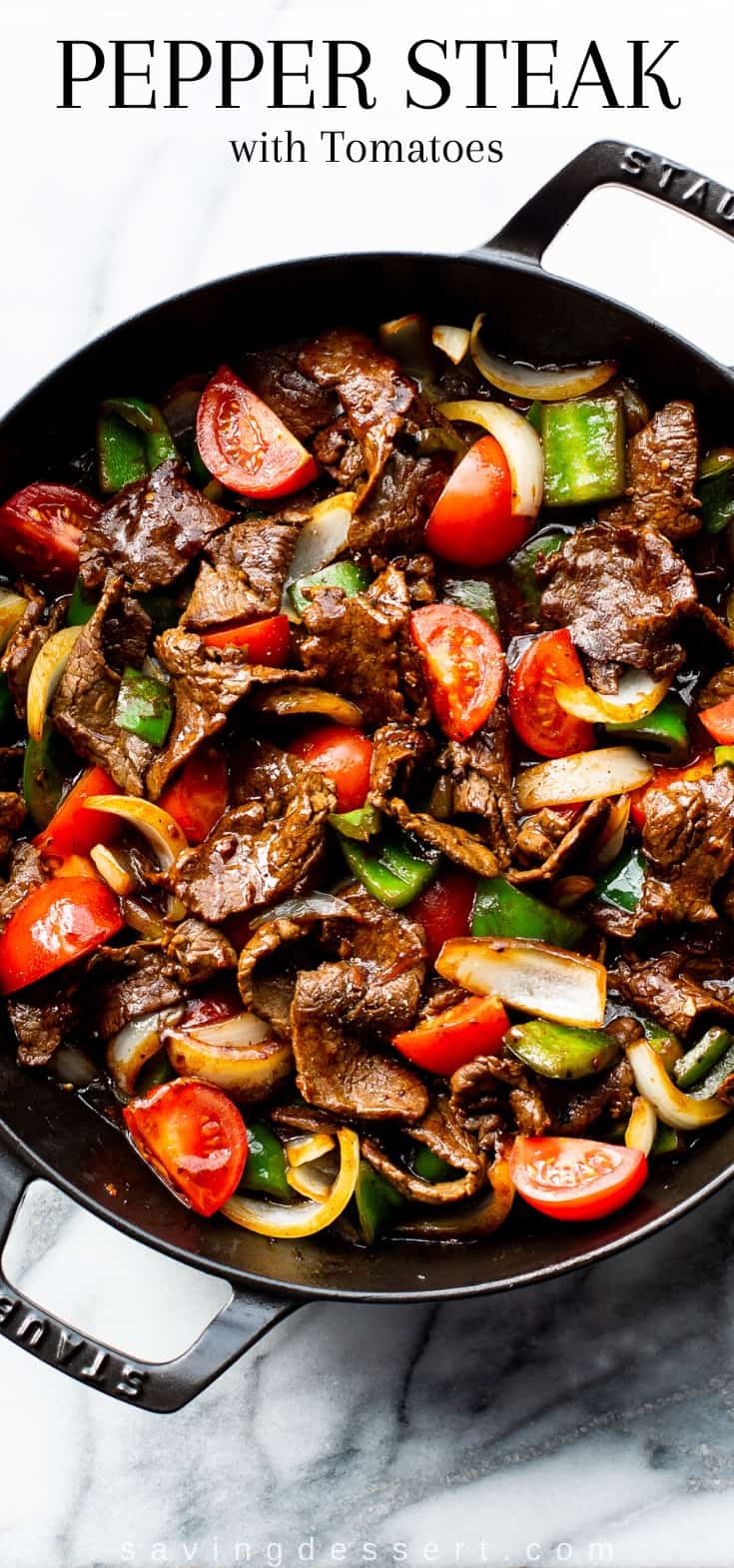 A skillet filled with green pepper steak