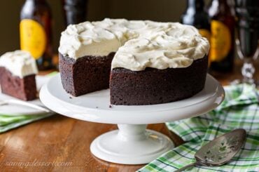 A dark chocolate Guinness cake topped with fluffy white icing