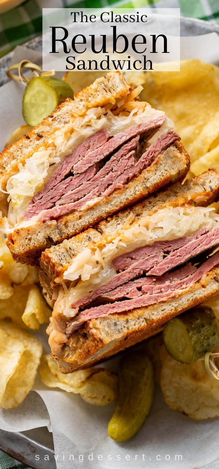 A close up of a Reuben sandwich served with chips