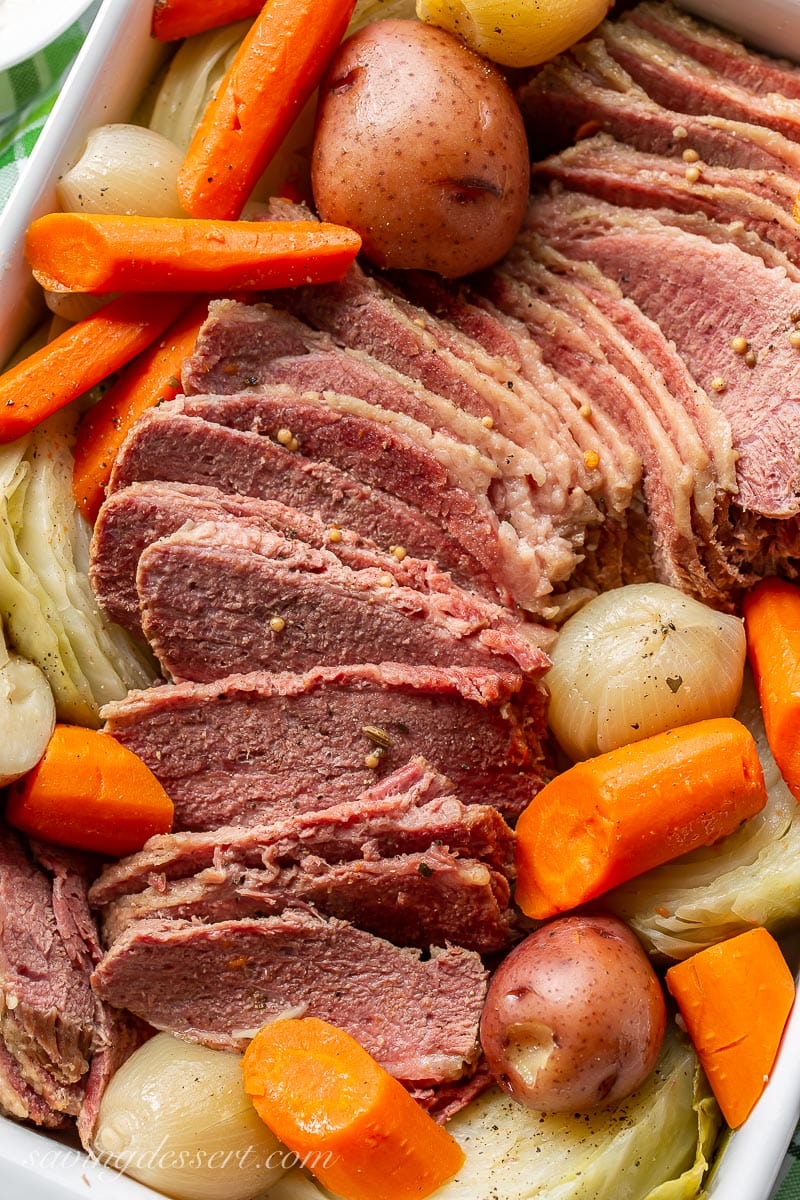 Close up of sliced Corned Beef and Cabbage with carrots and potatoes