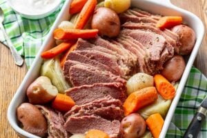 A casserole dish filled with slow-cooker corned beef and cabbage