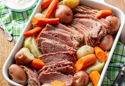 A casserole dish filled with slow-cooker corned beef and cabbage