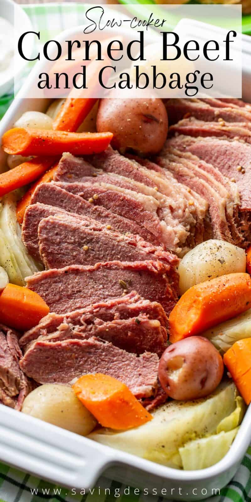 A baking dish filled with corned beef, cabbage and vegetables