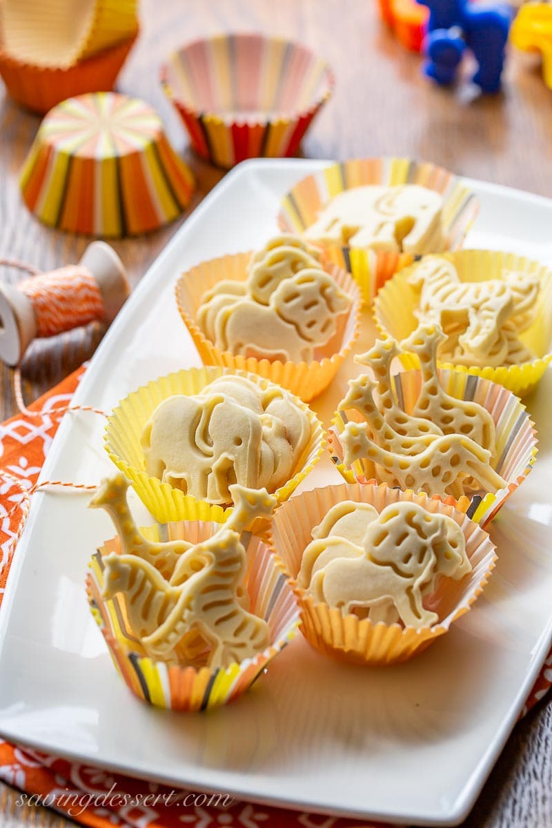 A platter of zoo animal cookies in paper cups