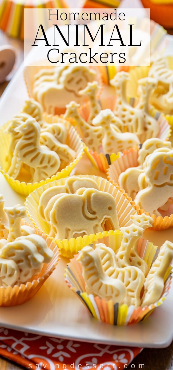 A platter of homemade animal crackers in decorative muffin cups