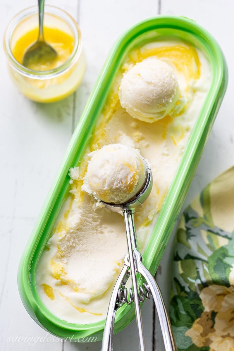 A freezer container of lemon curd ice cream