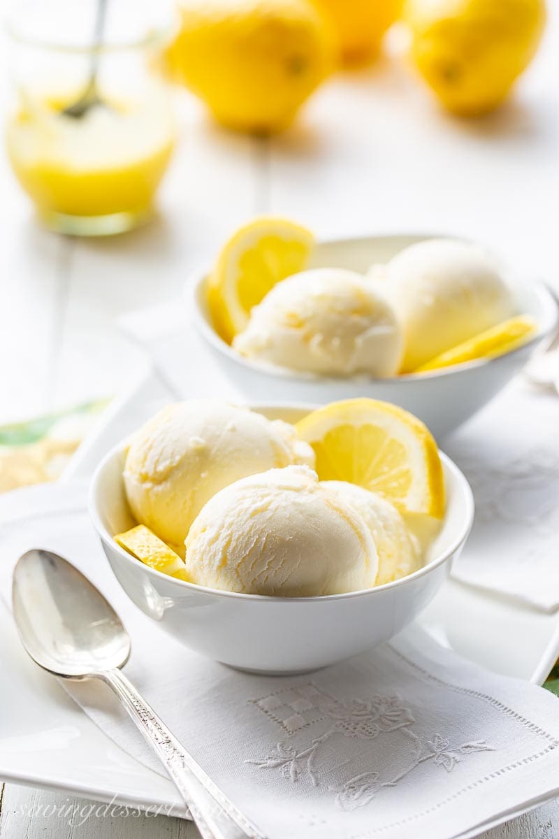 Scoops of lemon ice cream with lemon curd in a jar