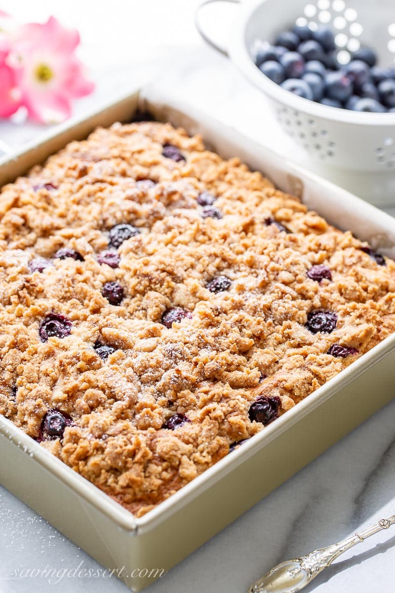 A pan with streusel topped blueberry coffee cake