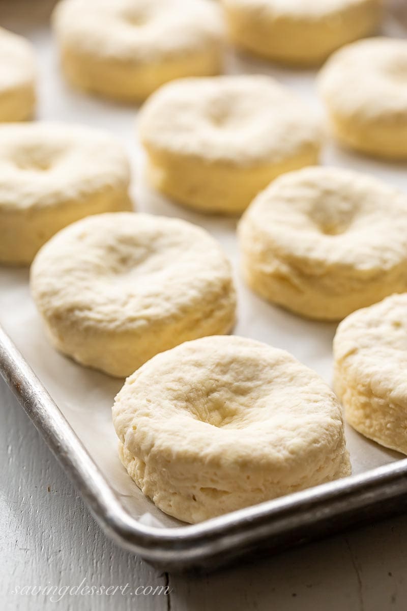 A pan with unbaked buttermilk biscuits