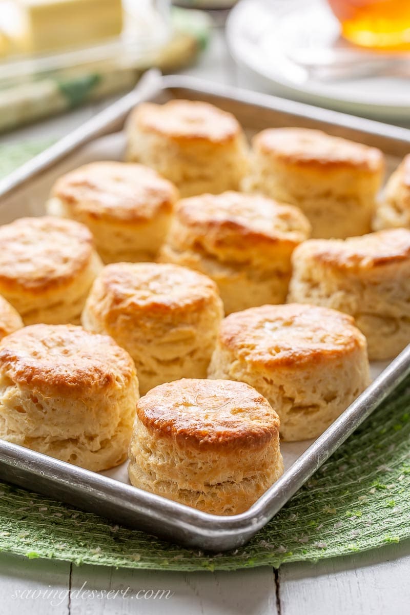 A pan of hot buttermilk biscuits brushed with melted butter