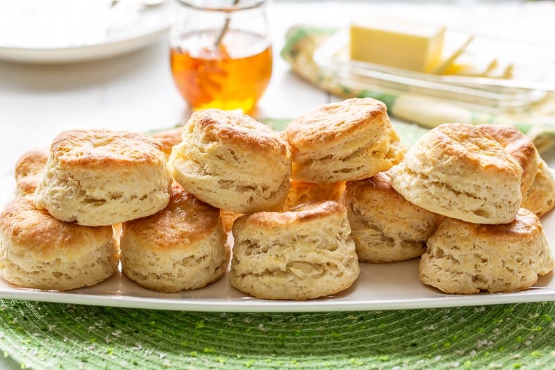 A platter of stacked buttermilk biscuits