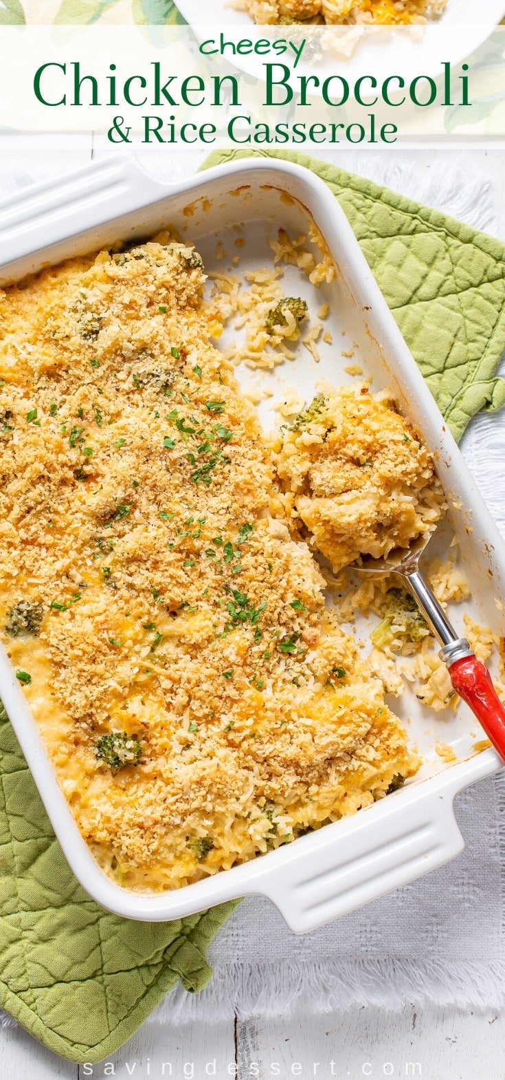 A casserole dish with a scoop of chicken broccoli and rice 