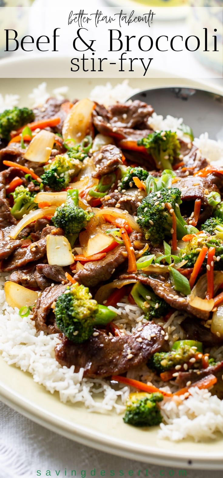 A platter with rice, beef and broccoli stir-fry garnished with sesame seeds