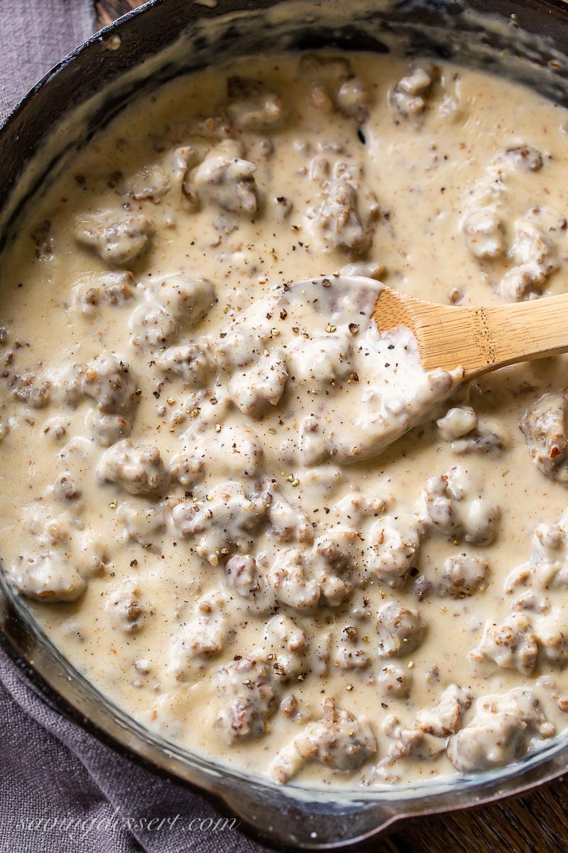 A cast iron skillet filled with sausage gravy