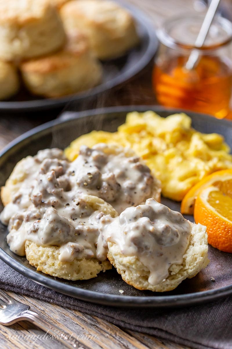 A plate with biscuits covered in hot country-style sausage gravy