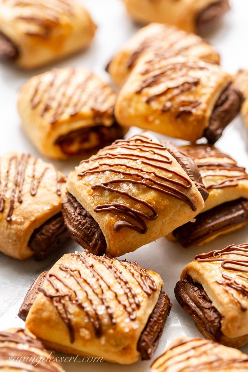 A closeup of a tray of chocolate topped croissant cookies