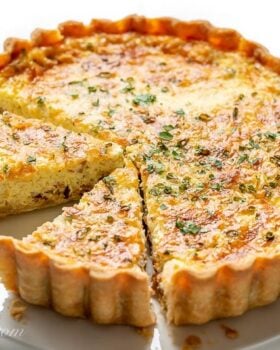 overhead view of sliced classic quiche lorraine