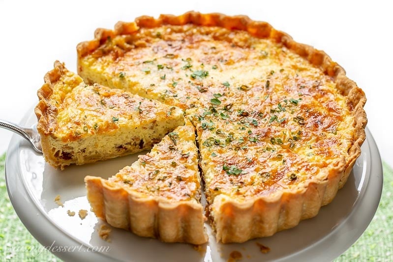 overhead view of sliced classic quiche lorraine