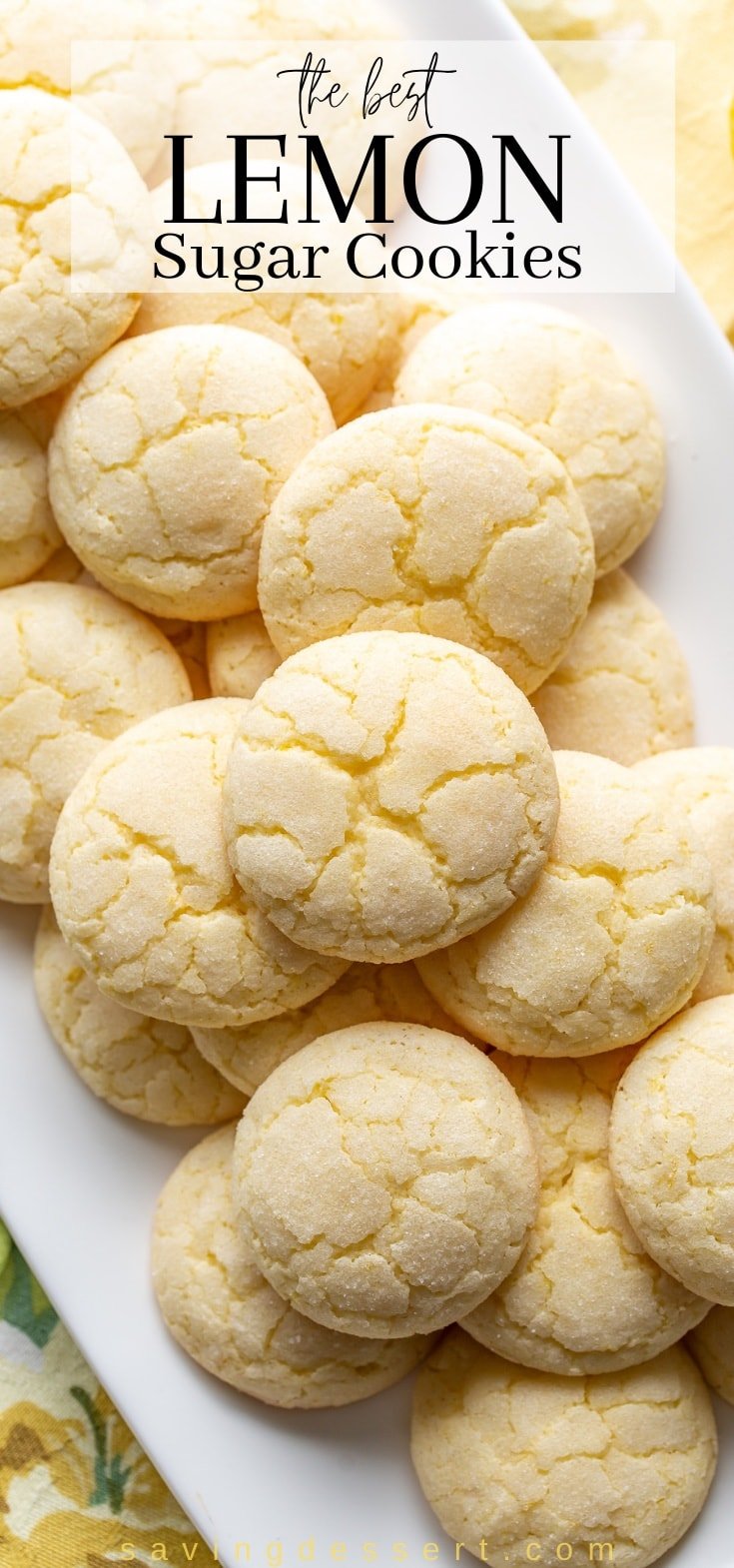 A platter of lemon sugar coated cookies with cracks on top