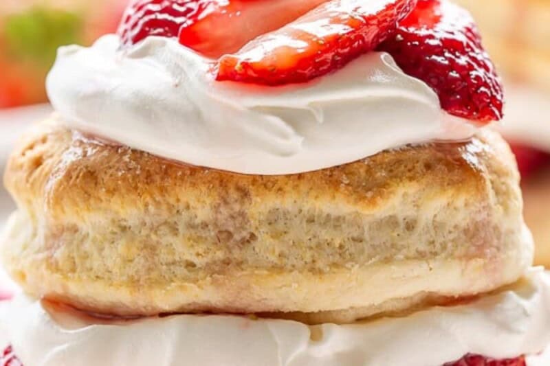 A closeup of a stacked strawberry shortcake recipe.