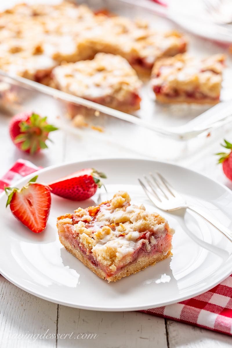 A plate with a square of strawberry rhubarb crumble bars