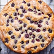 A single layer blackberry cake with sugary top