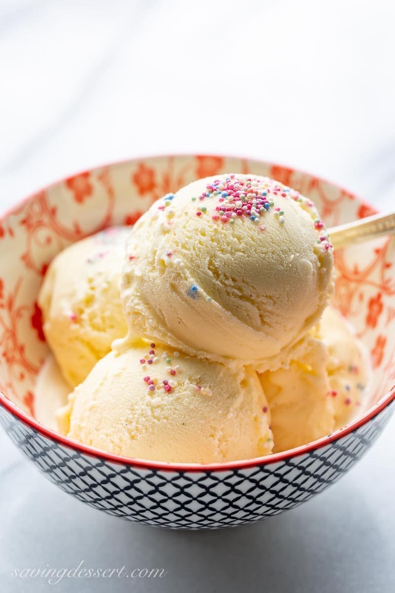 A small bowl of ice cream with sprinkles on top