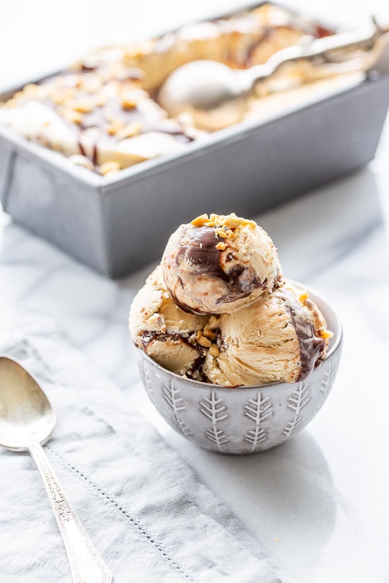 A bowl of peanut butter fudge ripple ice cream with a spoon