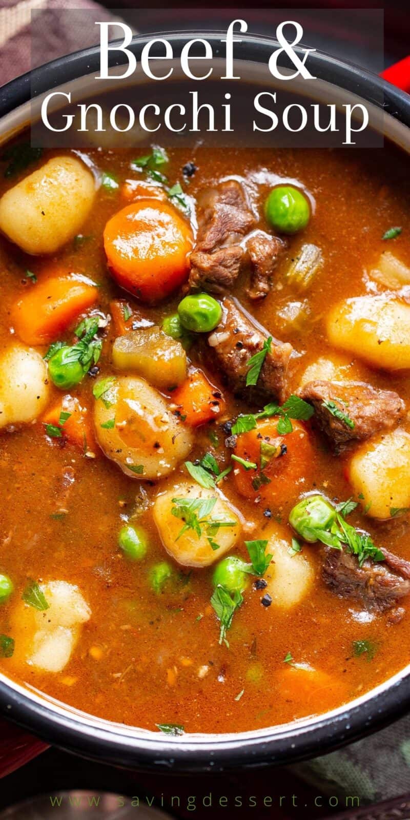 A closeup of a bowl of beef soup with gnocchi