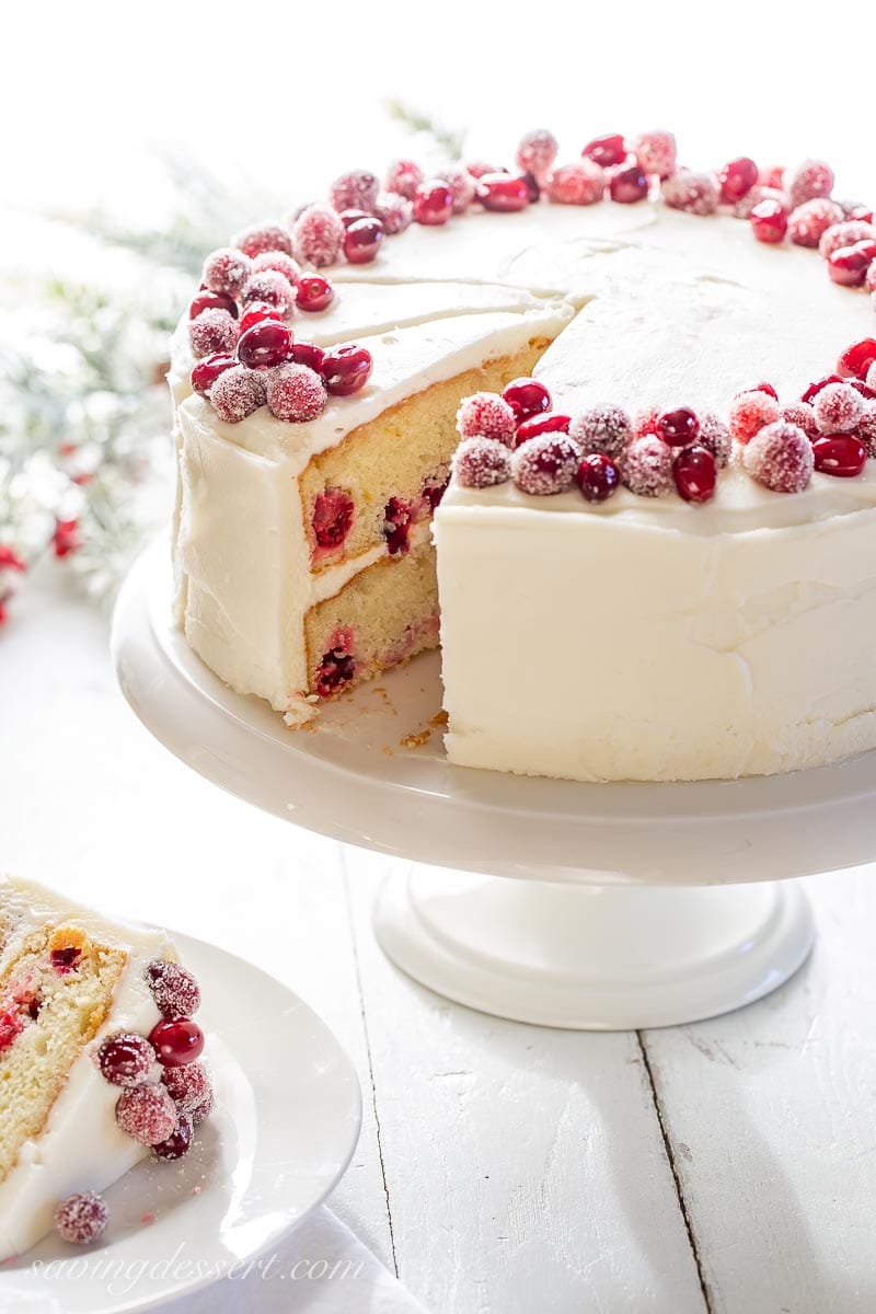Close up of a sliced cranberry layer cake