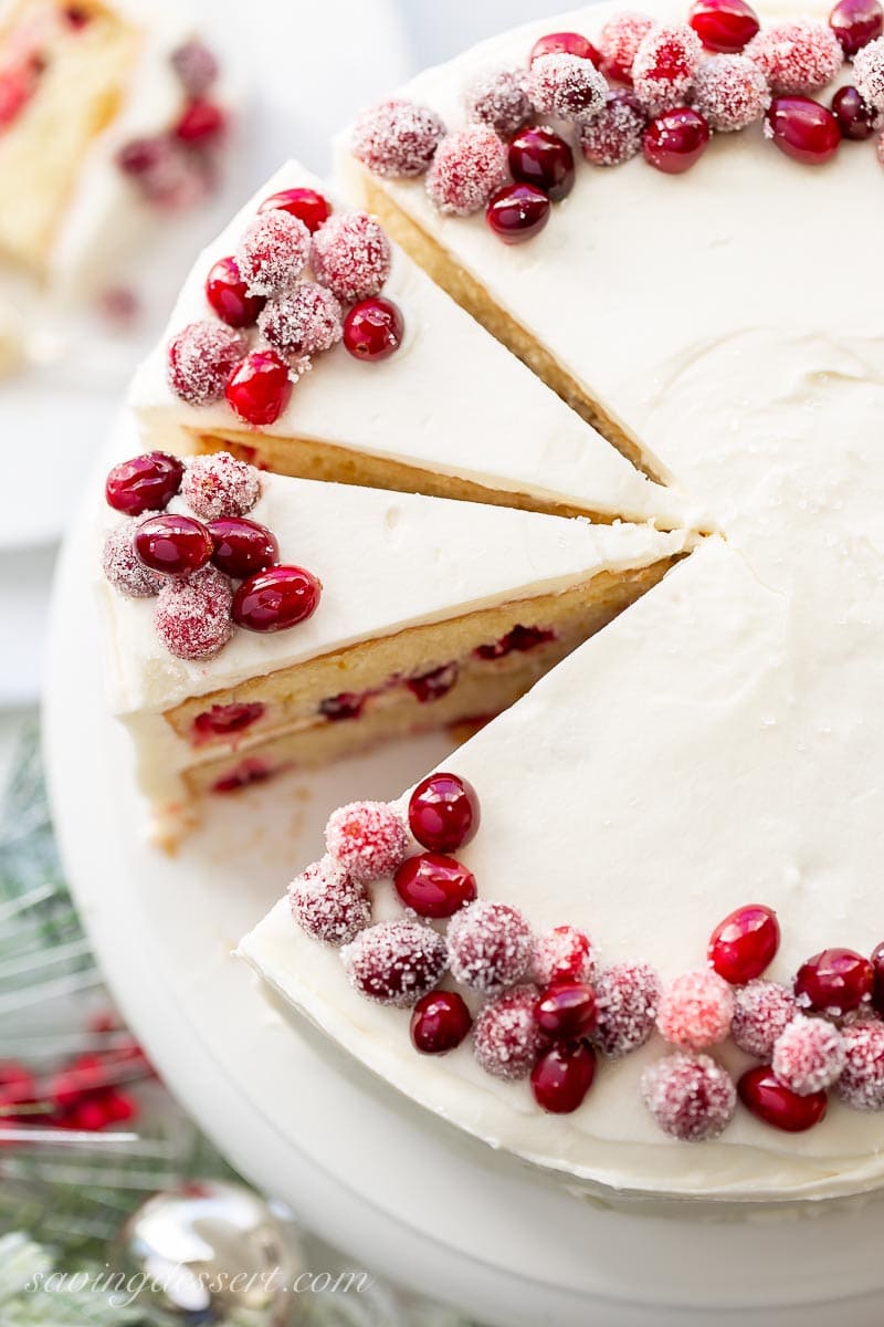 Slices of a cranberry cake decorated with sugared cranberries