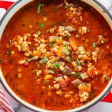 A soup pot filled with beefy barley soup