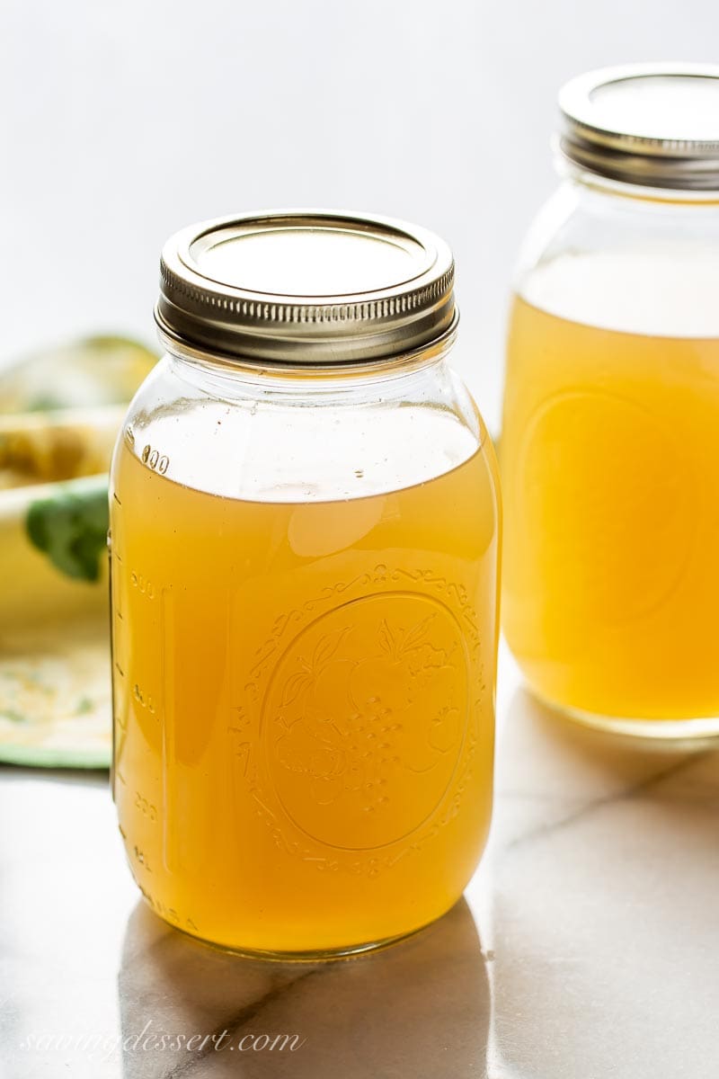 Jars of rich homemade chicken broth