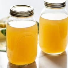 Two jars of homemade chicken broth