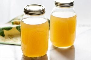 Two jars of homemade chicken broth