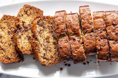 Overhead view of a platter of sliced banana bread with chocolate chips