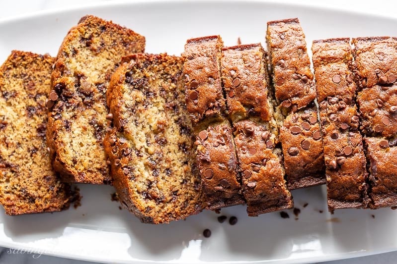 Overhead view of a platter of sliced banana bread with chocolate chips