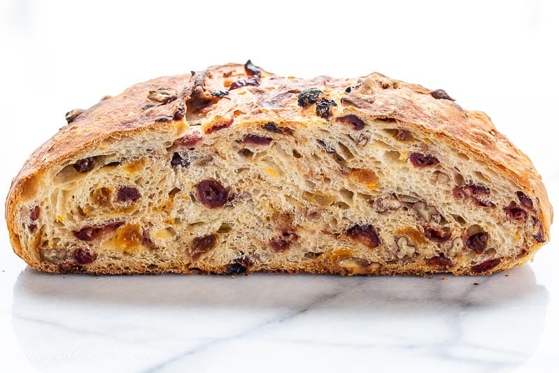 Harvest Bread sliced in half showing raisins and cranberries