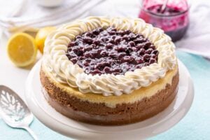 Blueberry Cheesecake with lemon on a cake stand