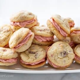 A platter of strawberry buttercream filled strawberry cookies