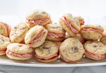 A platter of strawberry buttercream filled strawberry cookies