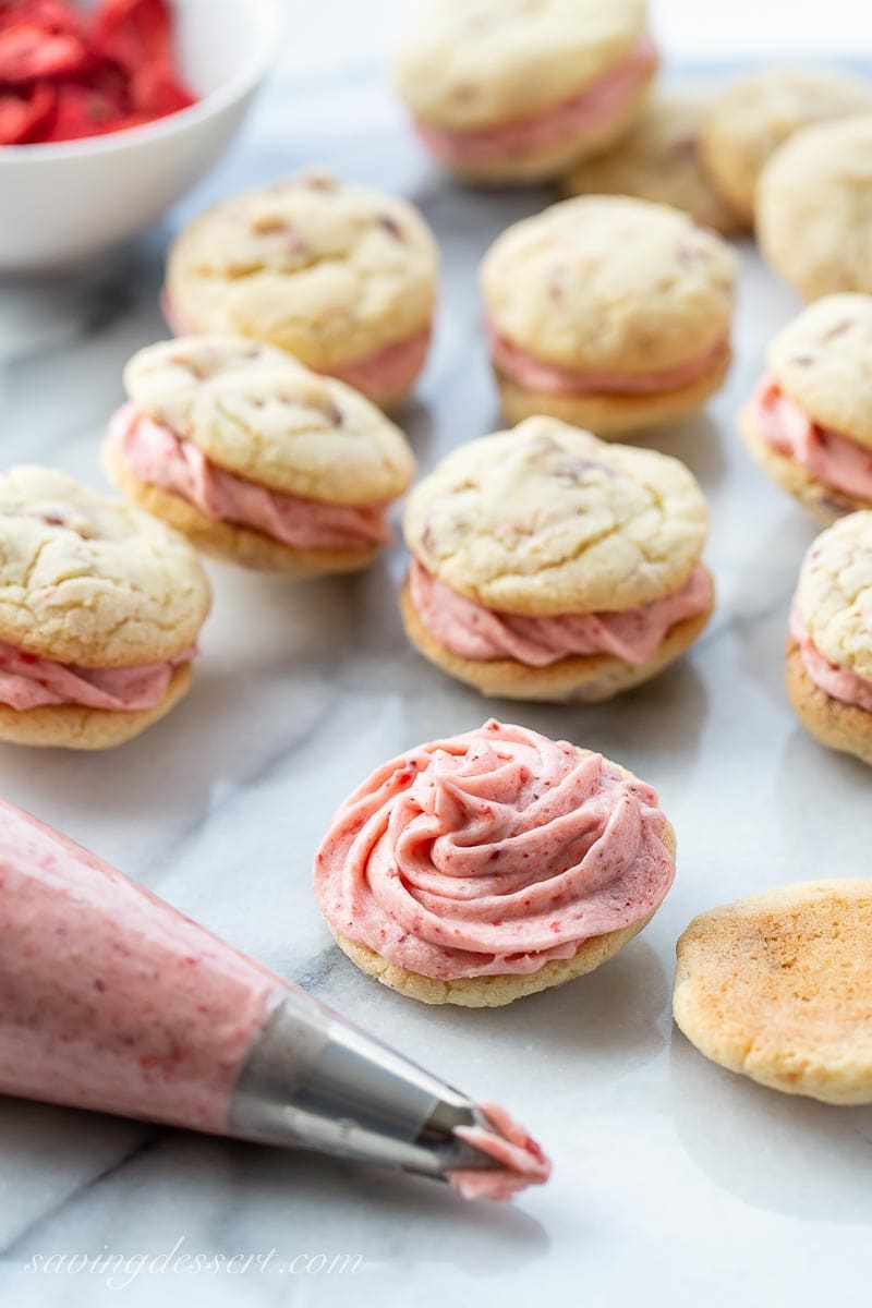 Strawberry Cookies with strawberry buttercream piped into the middle