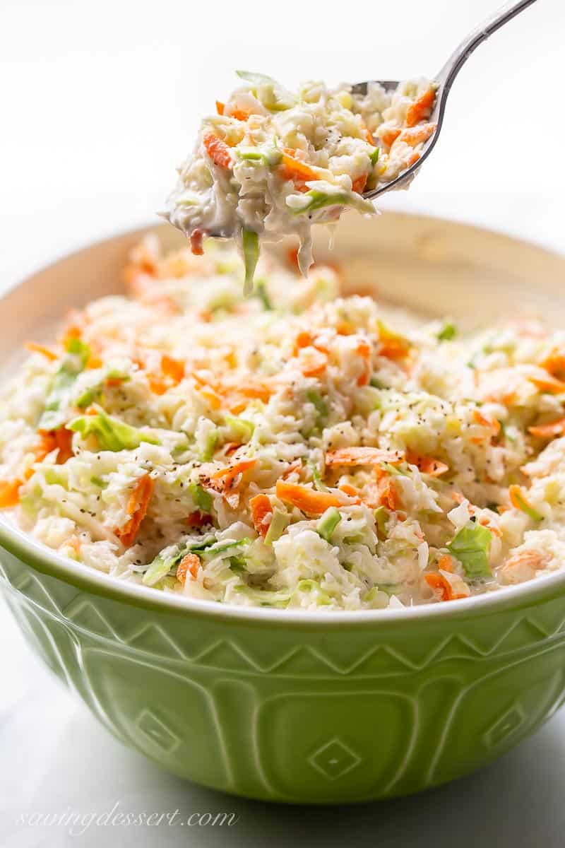 A bowl of creamy coleslaw with carrots