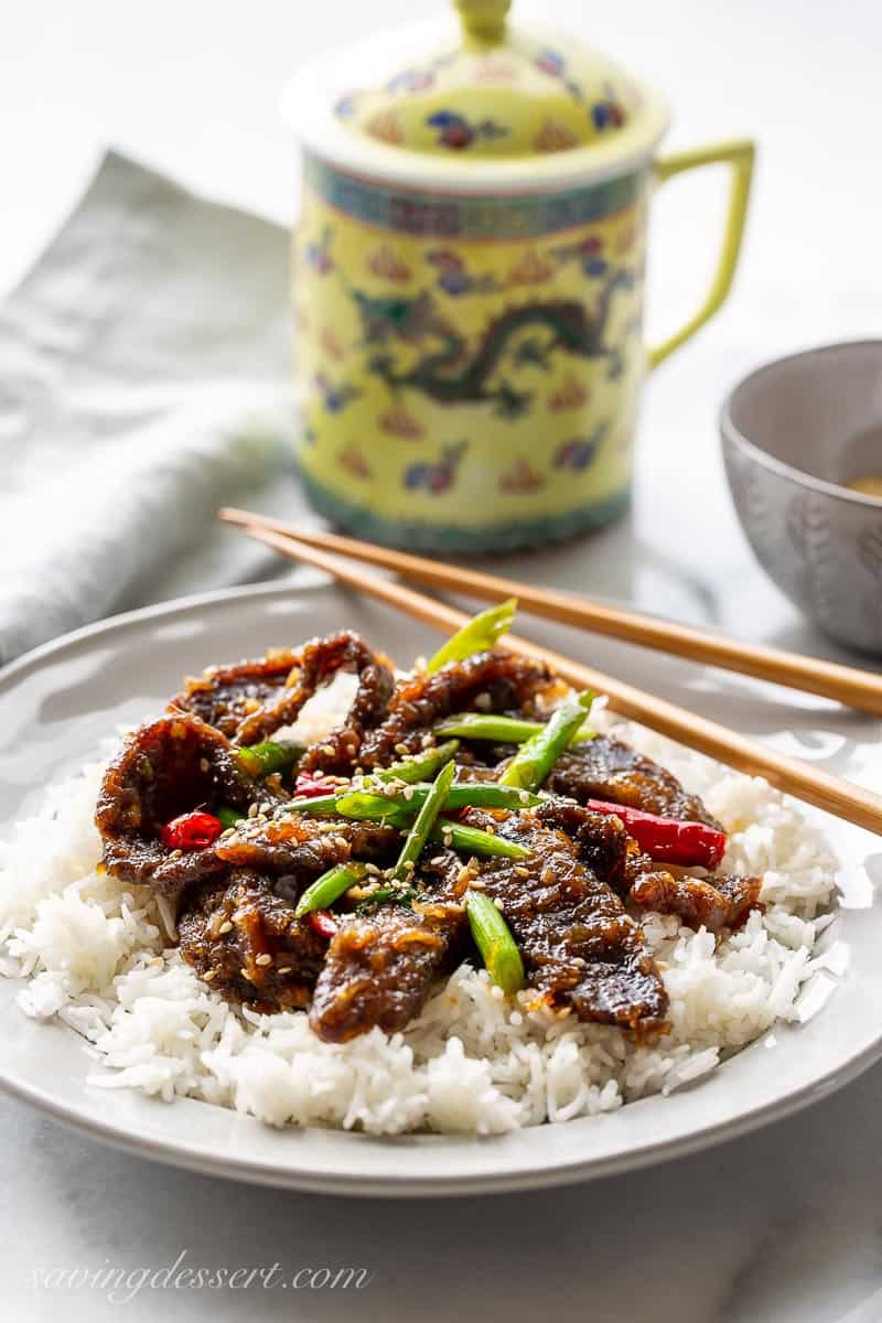A plate with rice and Mongolian Beef with peppers