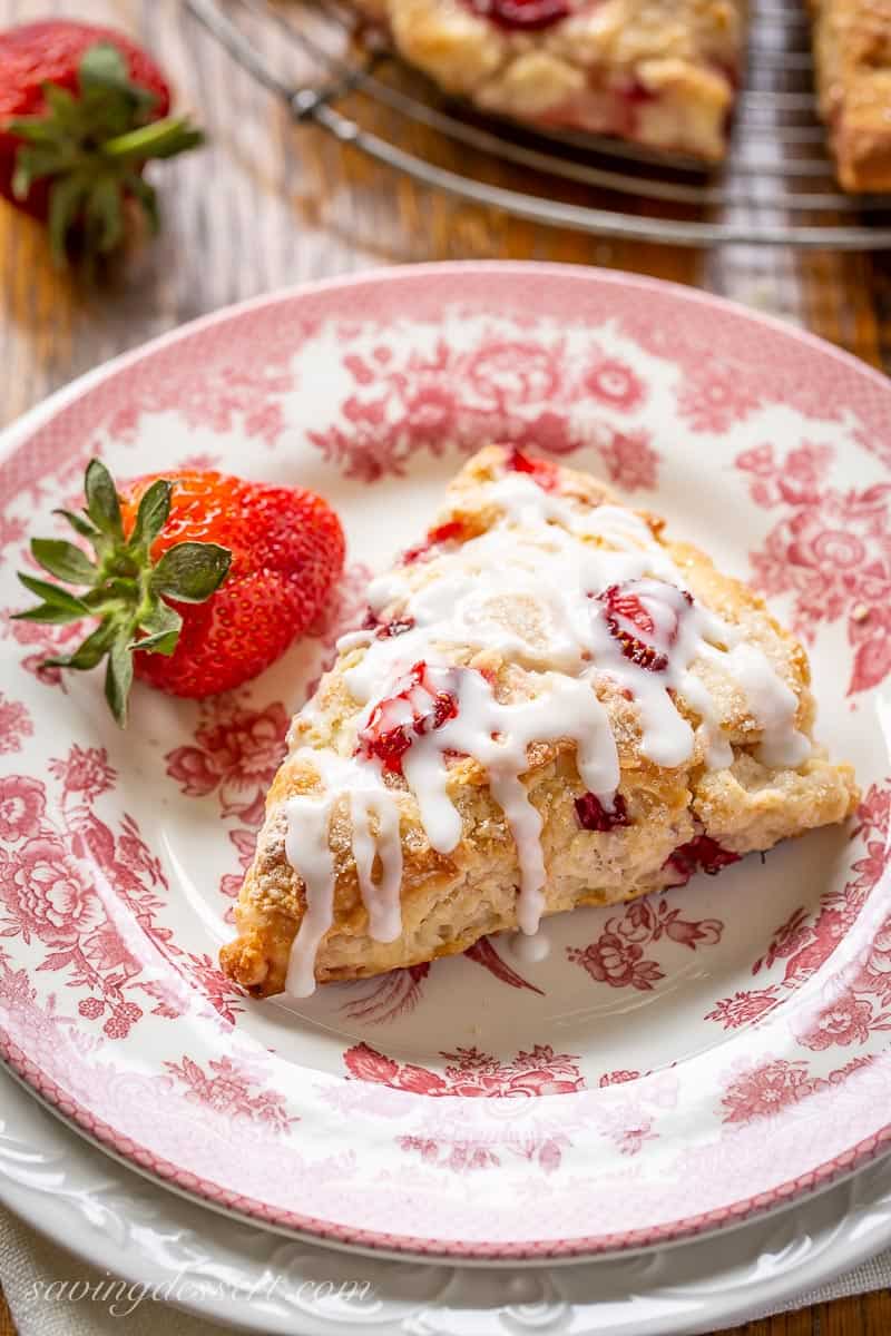 An overhead view of an iced strawberry scone