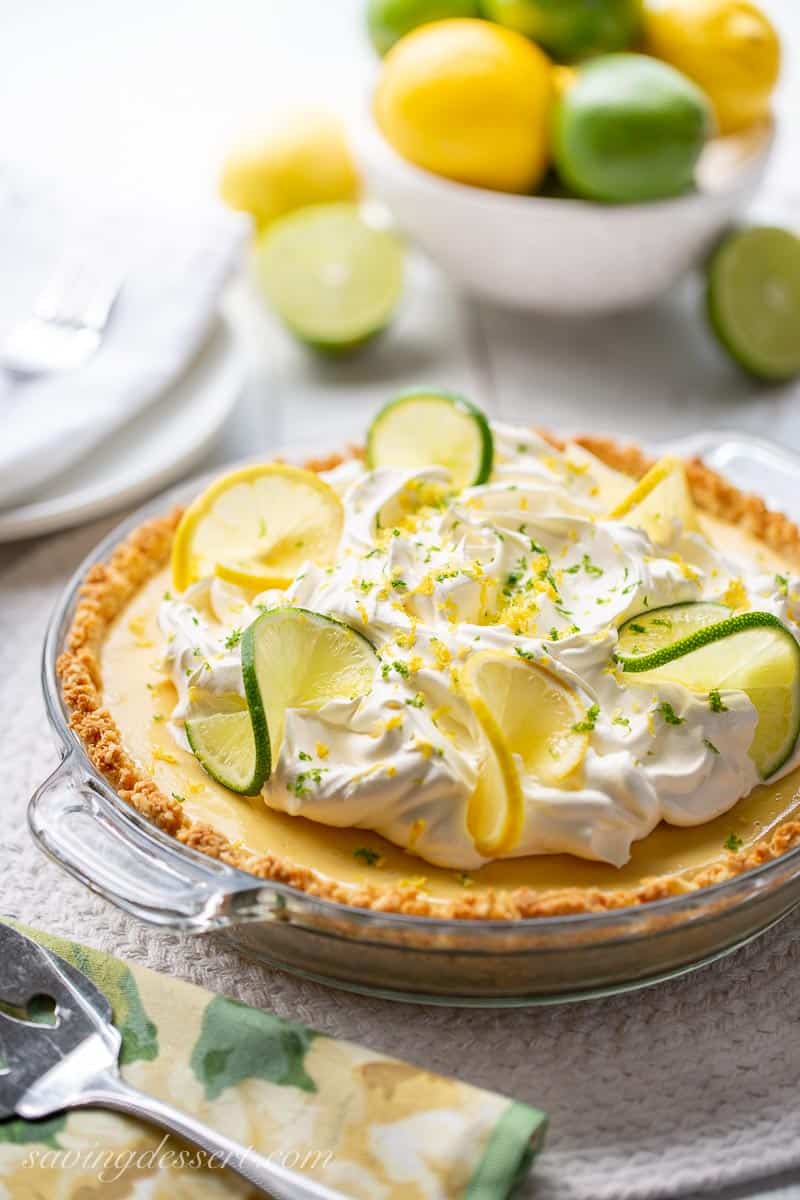 Atlantic Beach Pie topped with whipped cream, lemon and lime slices